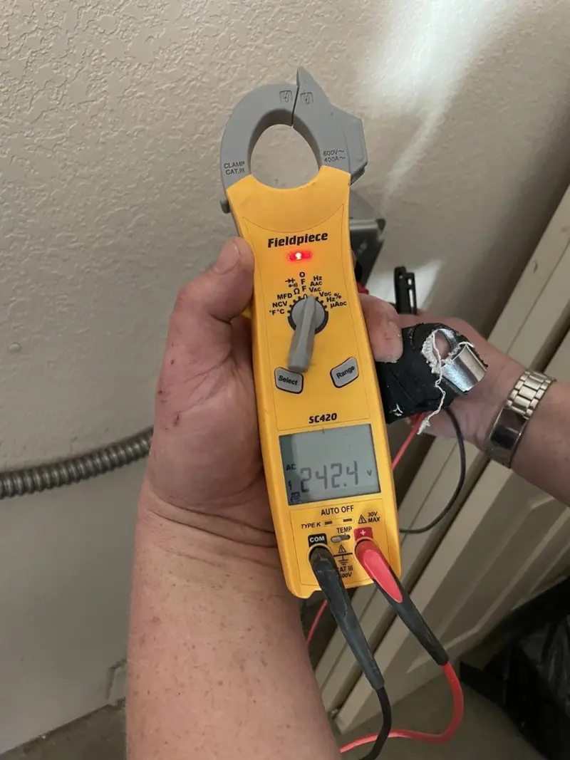 Voltage testing with clamp meter during Generator Installation in Elmwood